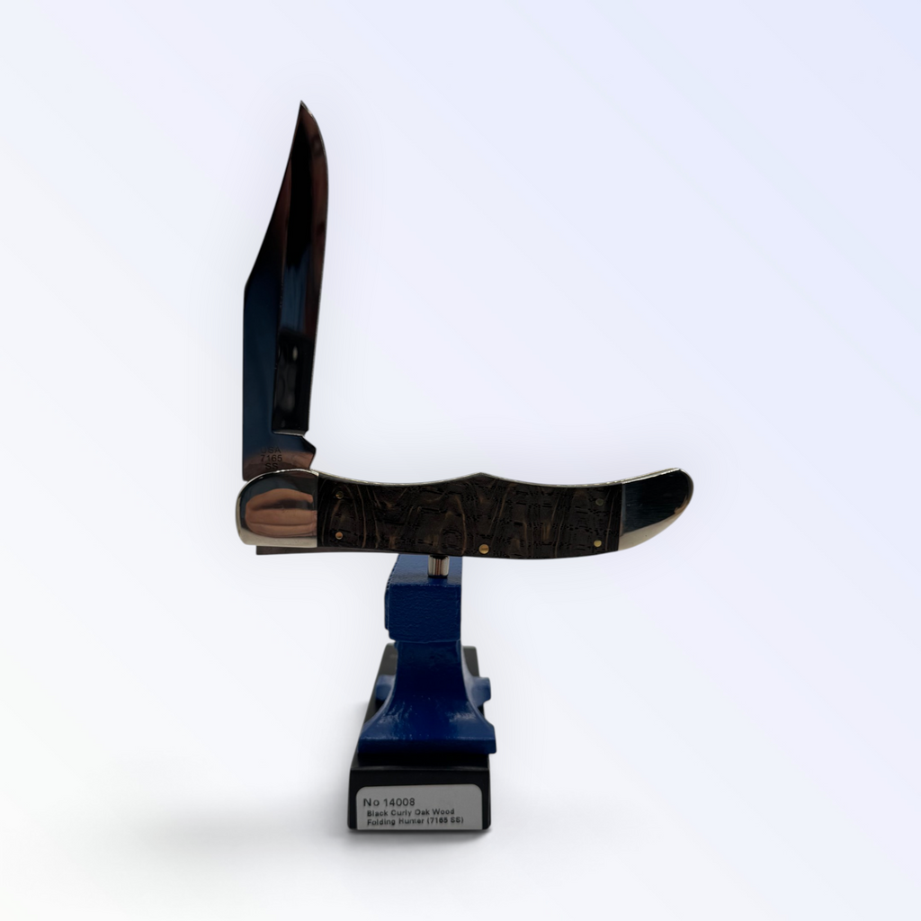 Case XX Folding Hunter (14008) featuring smooth black curly oak; studio shot open atop the retail box