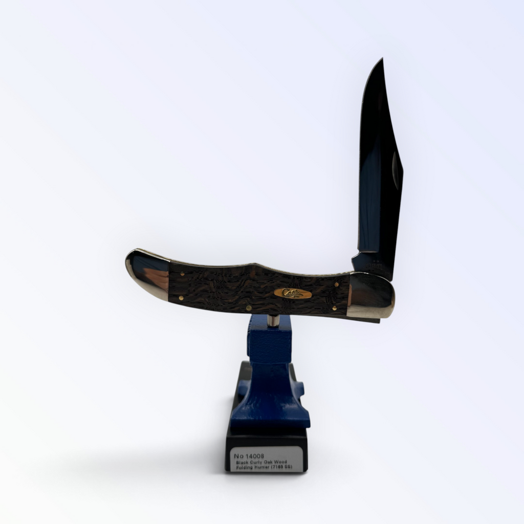 Case XX Folding Hunter with smooth black curly oak and clip and skinner blades, SKU 14008 — blades open resting on the factory box