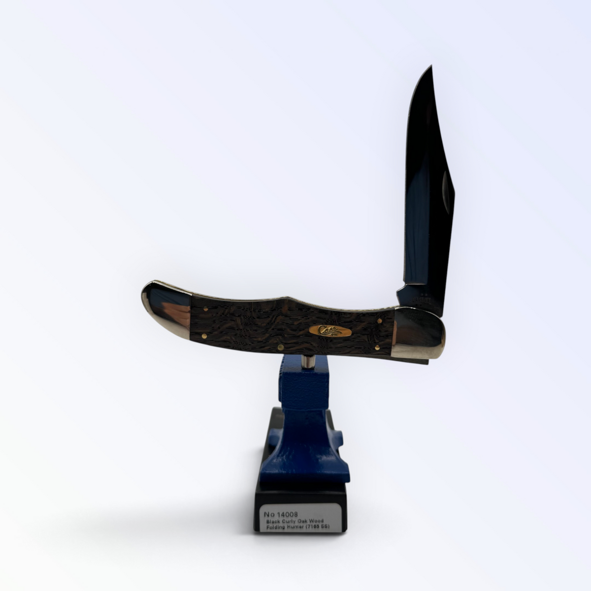 Case XX Folding Hunter with smooth black curly oak and clip and skinner blades, SKU 14008 — blades open resting on the factory box