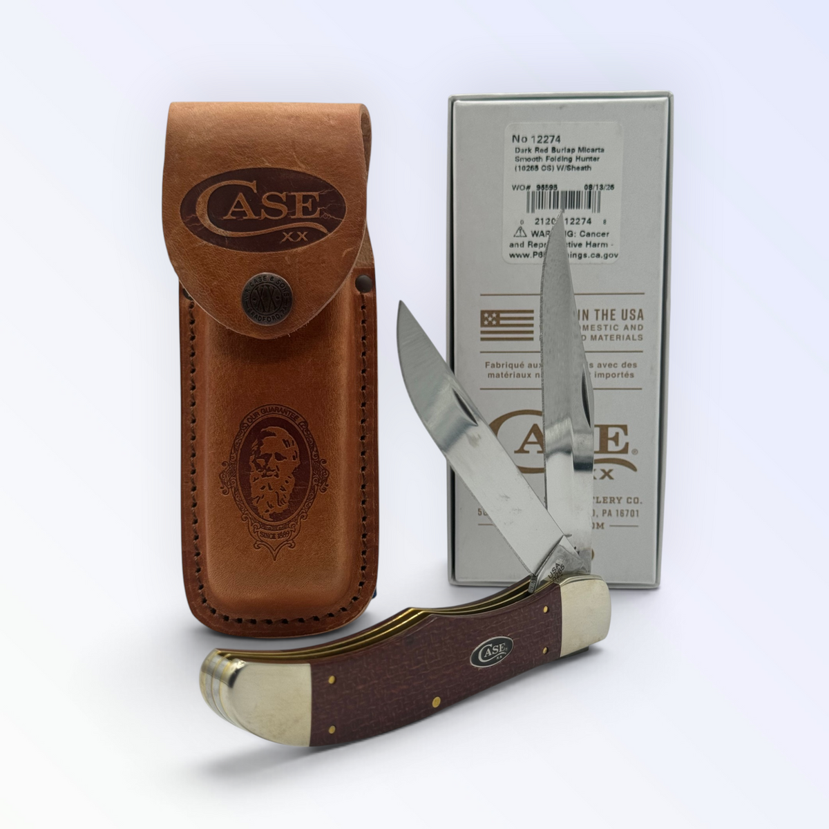 Pigeon Roost Knives Case XX Folding Hunter with dark red burlap Micarta handle, carbon steel blades, and leather sheath