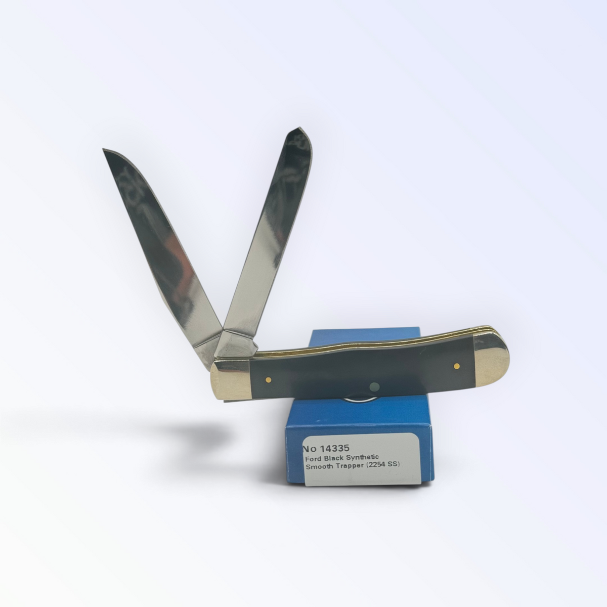 Ford F-150 Trapper Smooth Black Delrin by Case XX (14335), close view of handle texture with blades open on box