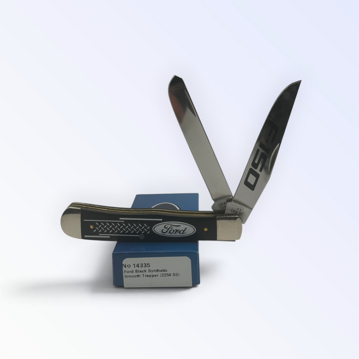 Case XX Ford F-150 Trapper Smooth Black Delrin with SKU 14335 — blades open resting on the factory box