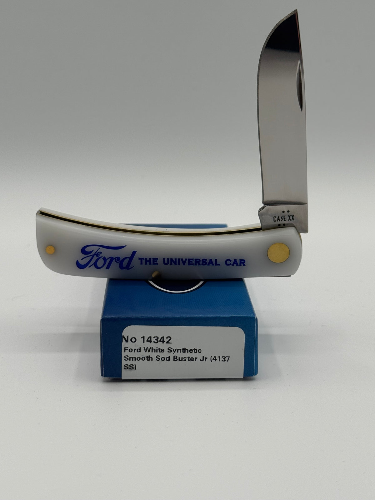 Case XX Ford Sod Buster Jr White The Universal Car with SKU 14342 — blades open resting on the factory box