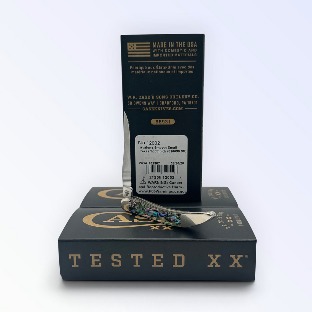 Catalog 12002 Case XX Genuine Abalone Tiny Toothpick — open blades resting on factory packaging
