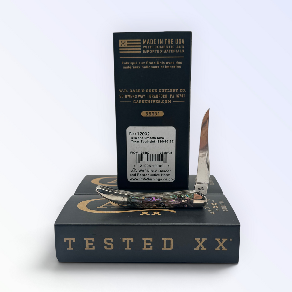 Case XX Genuine Abalone Tiny Toothpick with SKU 12002 — blades open resting on the factory box
