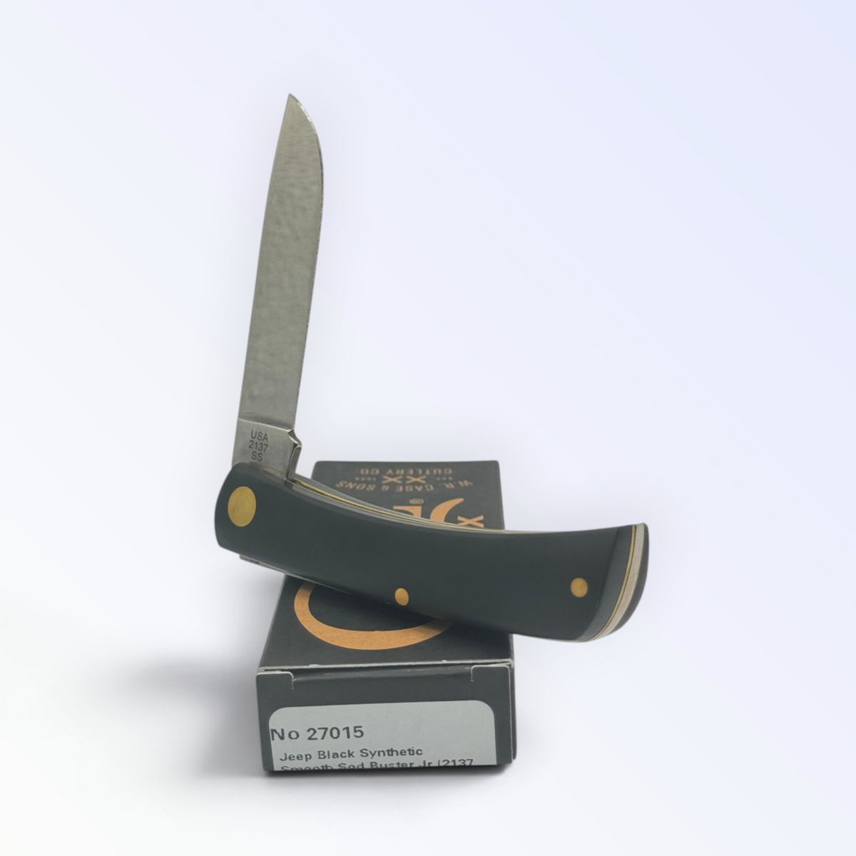 Catalog 27015 Case XX Jeep Black Synthetic Sodbuster Jr — open blades resting on factory packaging