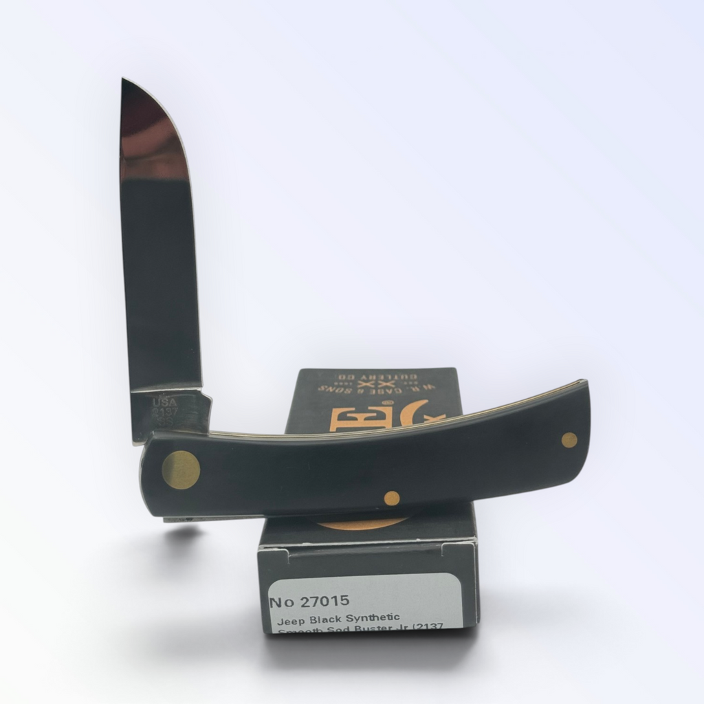 Jeep Black Synthetic Sodbuster Jr by Case XX (27015), close view of handle texture with blades open on box