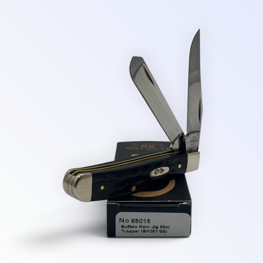 Case XX Jigged Genuine Buffalo Horn Mini Trapper, SKU 65016 — closed profile on the Case XX box