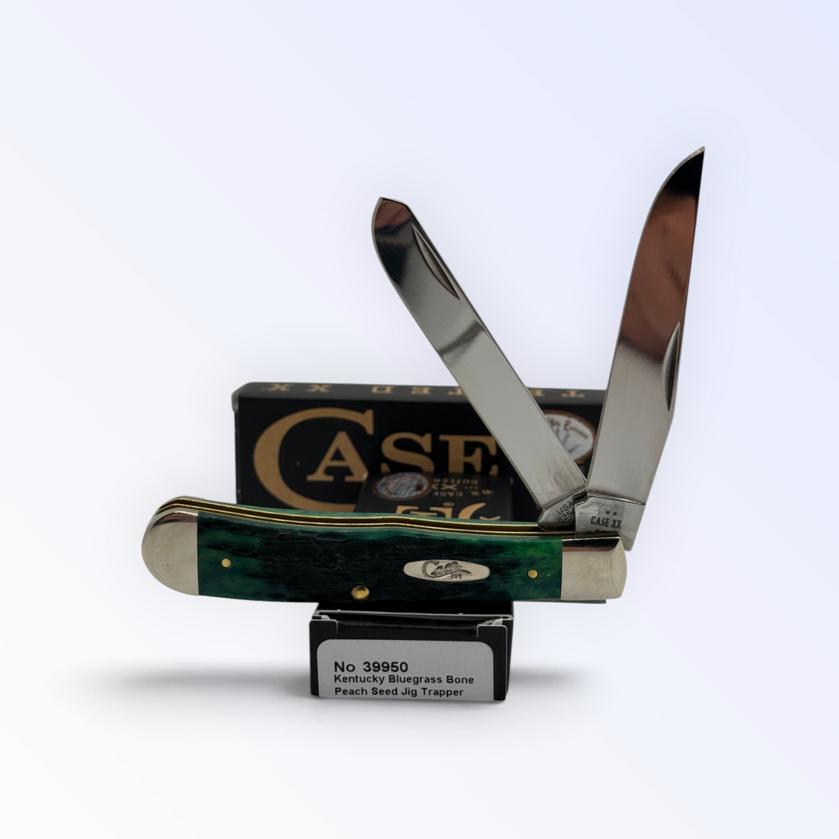 Case XX 39950 Kentucky Bluegrass bone Trapper with pocket clip — both blades open on Case XX box