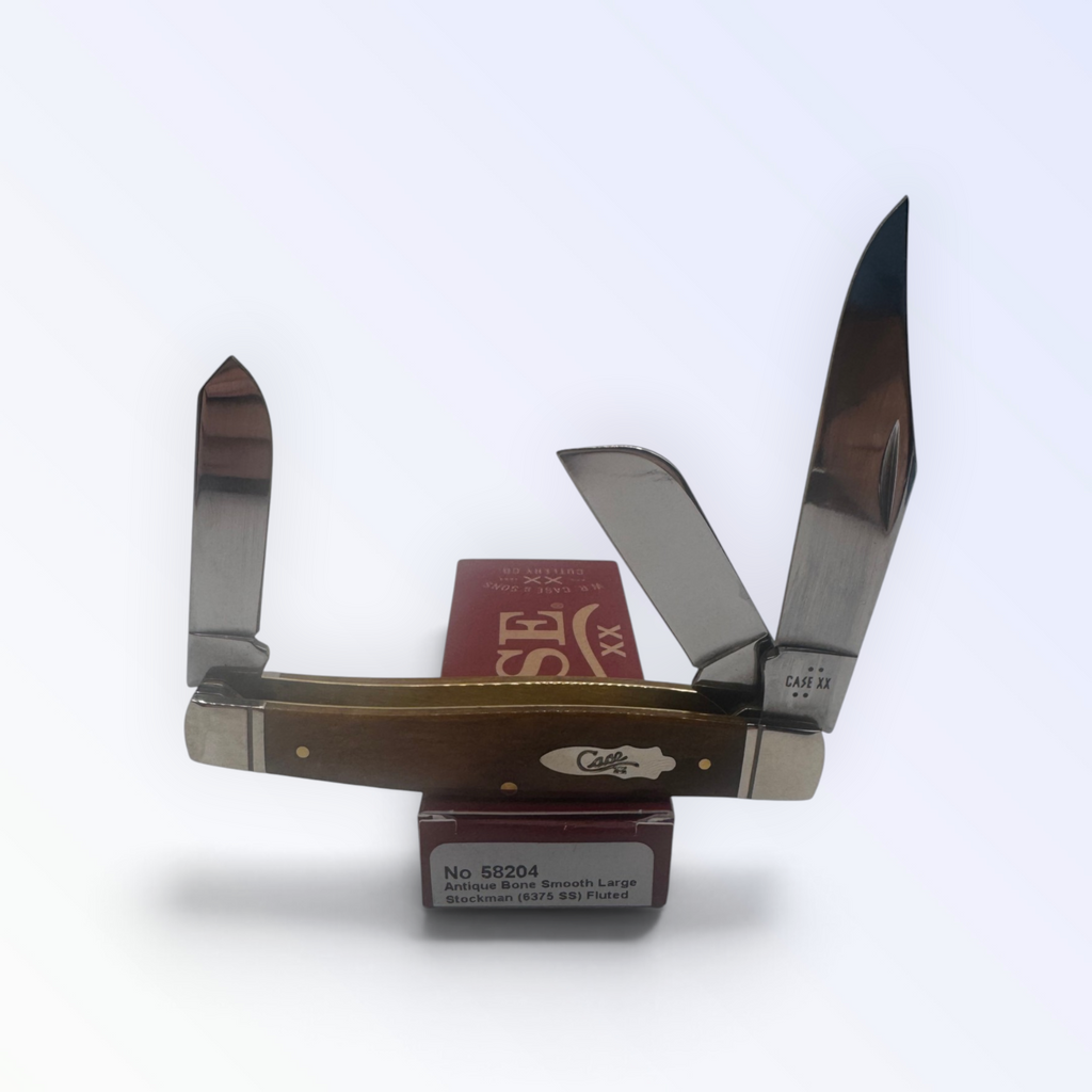 Case XX Large Stockman 58204: Antique Bone Smooth, angled view showing handle texture and bolsters