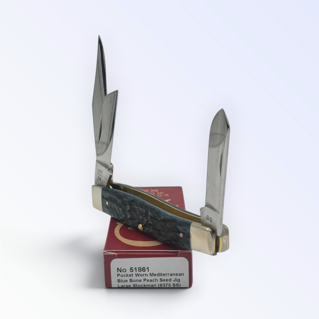 Catalog 51861 Case XX Large Stockman Pocket Worn Mediterranean Blue Bone — open blades resting on factory packaging