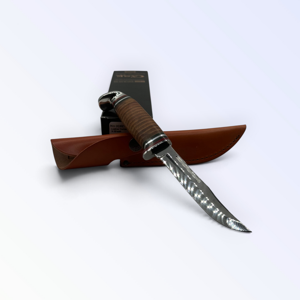 Pigeon Roost Knives Case XX slim fixed blade hunter with a polished stacked leather handle and brown leather sheath