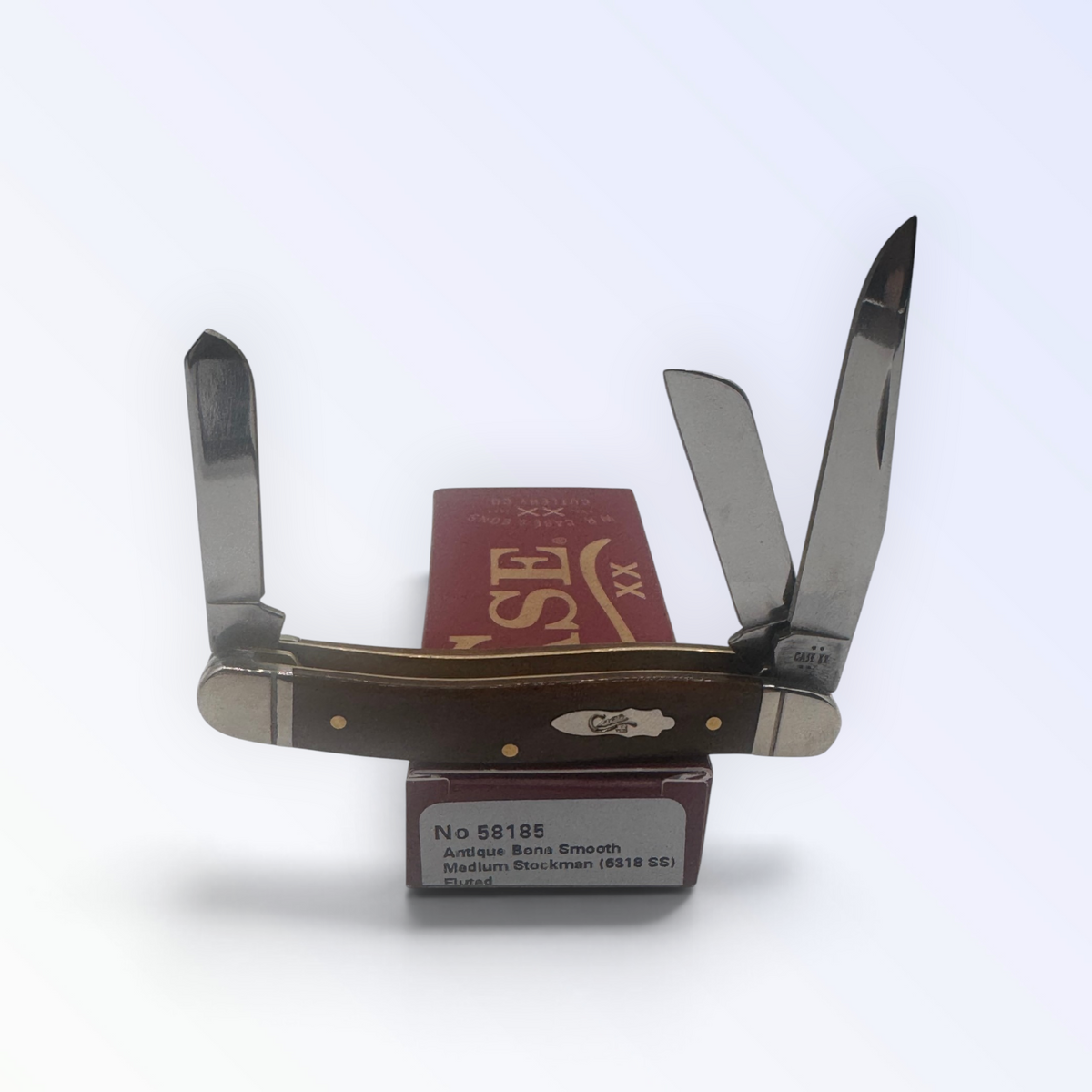 Medium Stockman by Case XX featuring Antique Bone Smooth (58185), pocket-knife studio shot on retail box