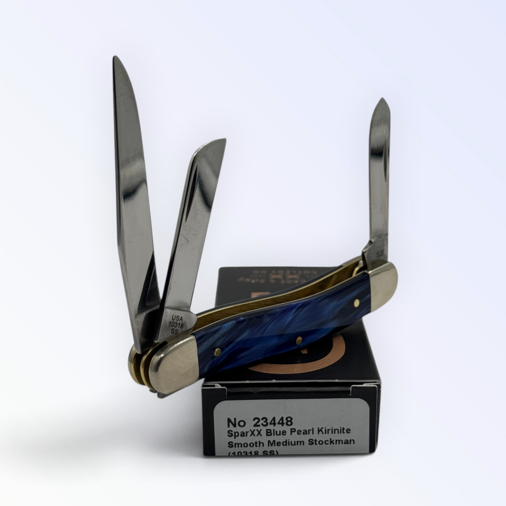 Catalog 23448 Case XX Medium Stockman — blue pearl Kirinite, close view of handle texture with blades open on box
