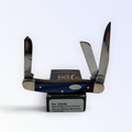 Case XX Medium Stockman with blue pearl Kirinite and three stainless blades, SKU 23448 — blades open resting on the factory box