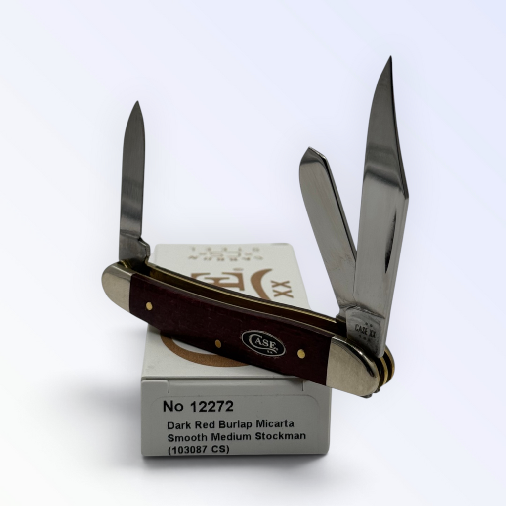 Case XX 12272 Medium Stockman in dark red burlap Micarta — angled open view on Case XX packaging