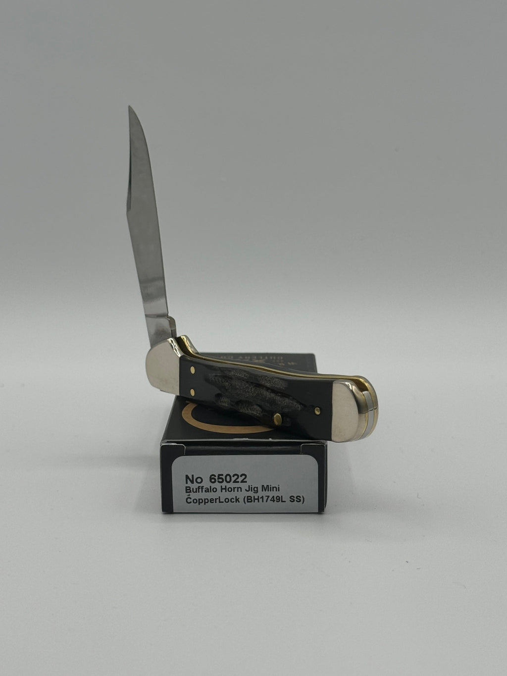 Pigeon Roost Knives Case XX Mini CopperLock pocket knife with jigged buffalo horn handle and locking clip blade.