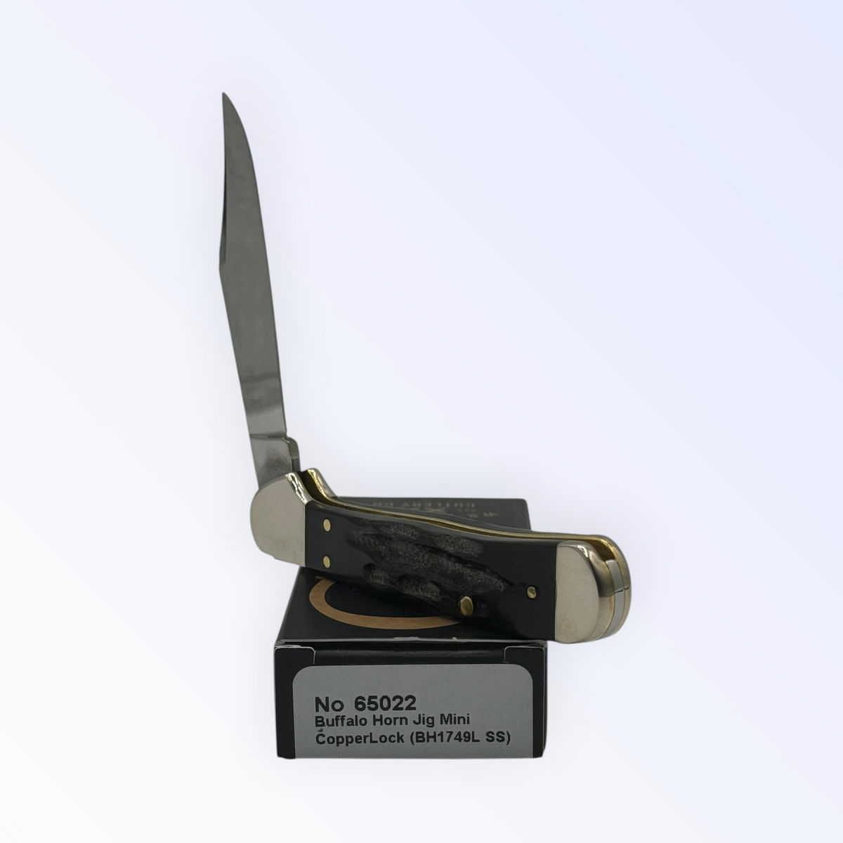 Pigeon Roost Knives Case XX Mini CopperLock pocket knife with jigged buffalo horn handle and locking clip blade.