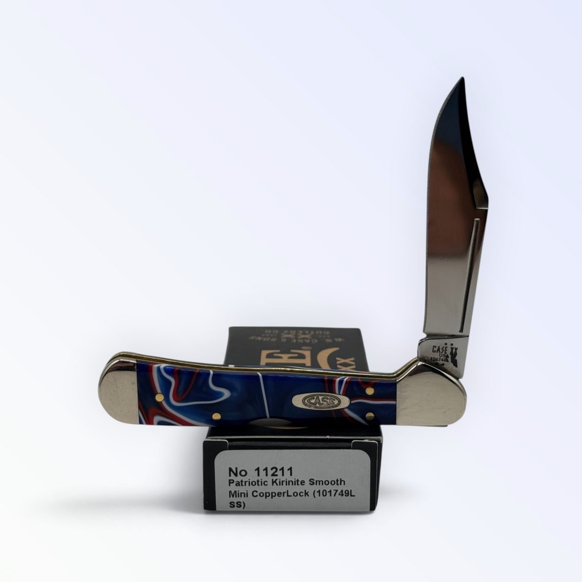 Case XX Mini CopperLock with Patriot Kirinite and locking clip blade, SKU 11211 — blades open resting on the factory box