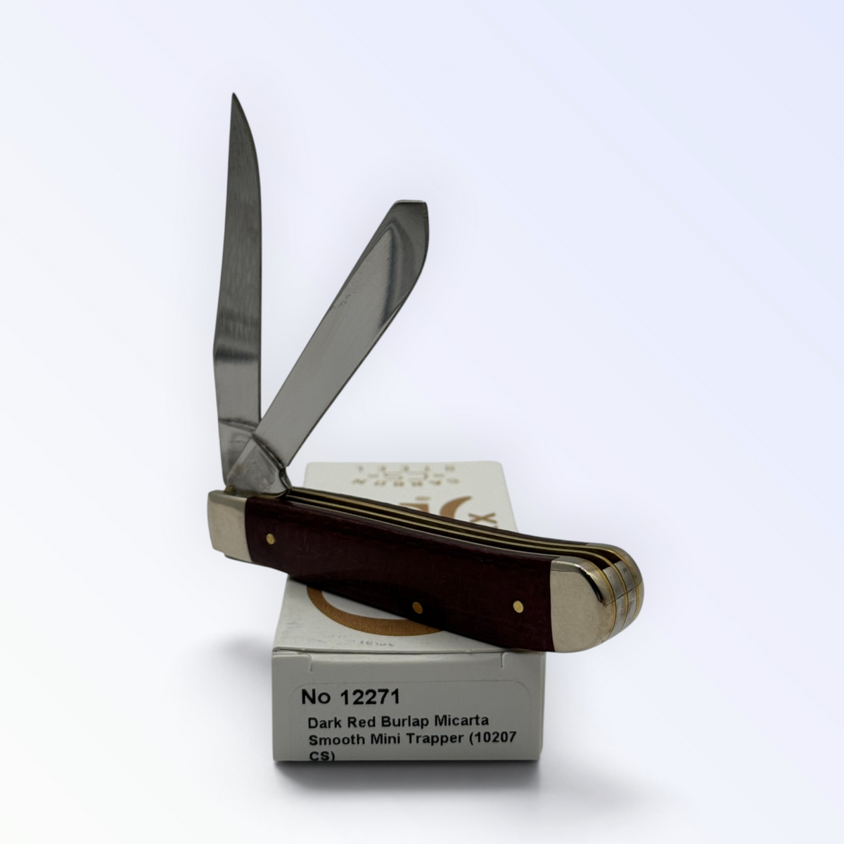 Case XX Mini Trapper 12271: dark red burlap Micarta, open on box with end label facing forward
