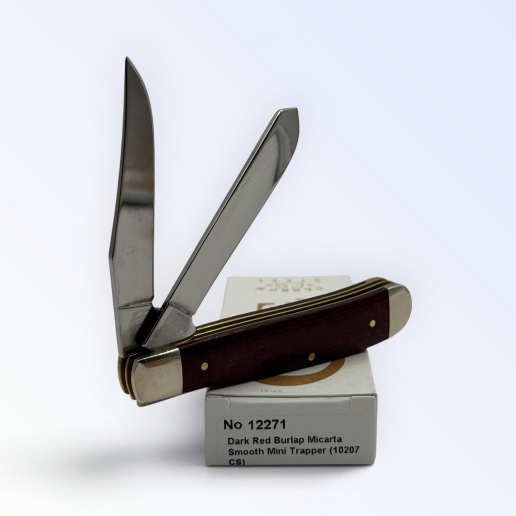 Catalog 12271 Case XX Mini Trapper — dark red burlap Micarta, close view of handle texture with blades open on box