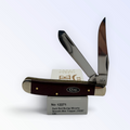 Case XX Mini Trapper with dark red burlap Micarta and 1095 carbon clip and spey, SKU 12271 — blades open resting on the factory box