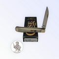 Case XX Mini Trapper with smooth natural bone and Wharncliffe and spey blades, SKU 11025 — blades open resting on the factory box