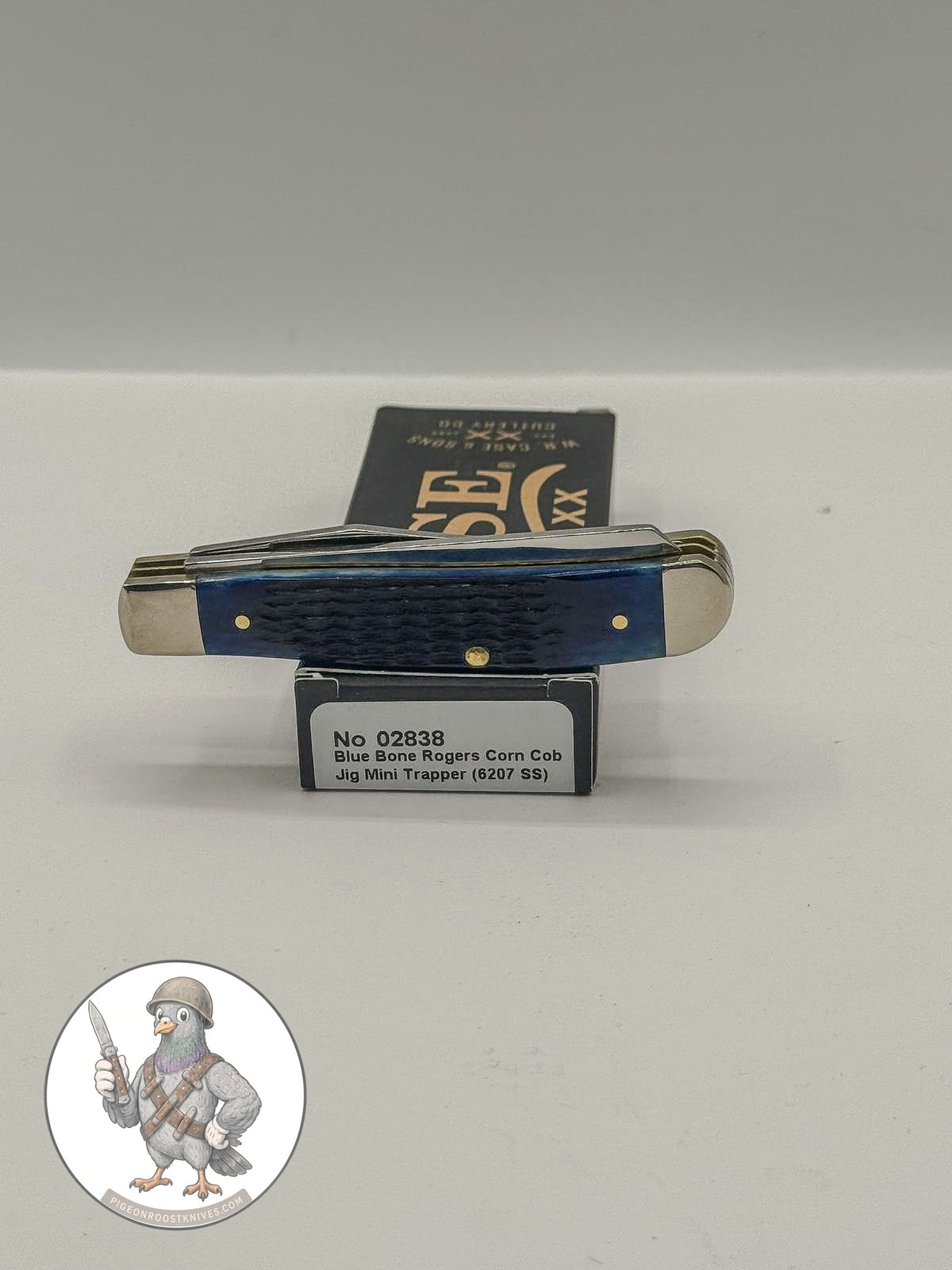 Case XX Mini Trapper 02838: jigged navy blue bone, studio shot open atop the retail box