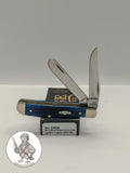 Case XX Mini Trapper with jigged navy blue bone and clip and spey blades, SKU 02838 — blades open resting on the factory box