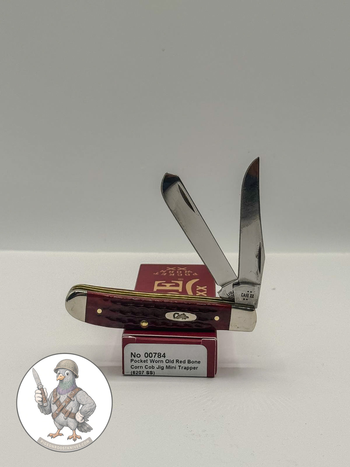 Mini Trapper by Case XX featuring Jigged Old Red Bone Pocket Worn (00784), pocket-knife studio shot on retail box