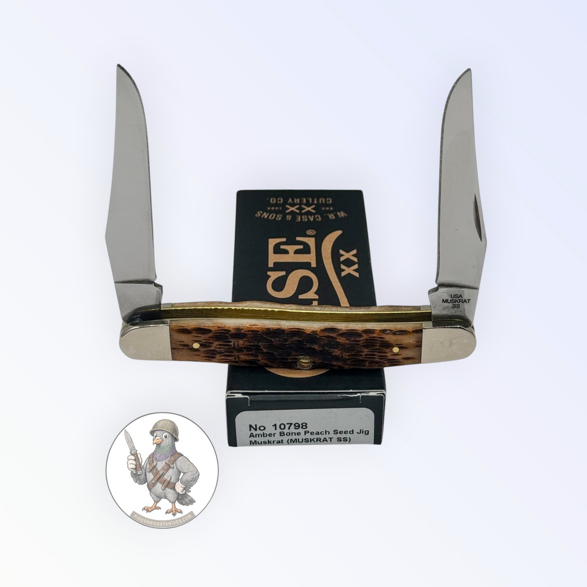 Muskrat by Case XX in jigged amber bone (10798), open on box with end label visible