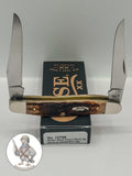 Case XX Muskrat with jigged amber bone and twin spey blades, SKU 10798 — blades open resting on the factory box