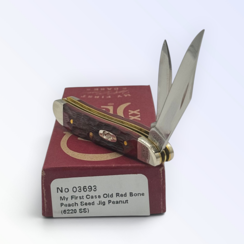 Case XX 03693 My First Case Old Red Bone Peach Seed Jig Peanut — angled open view on Case XX packaging