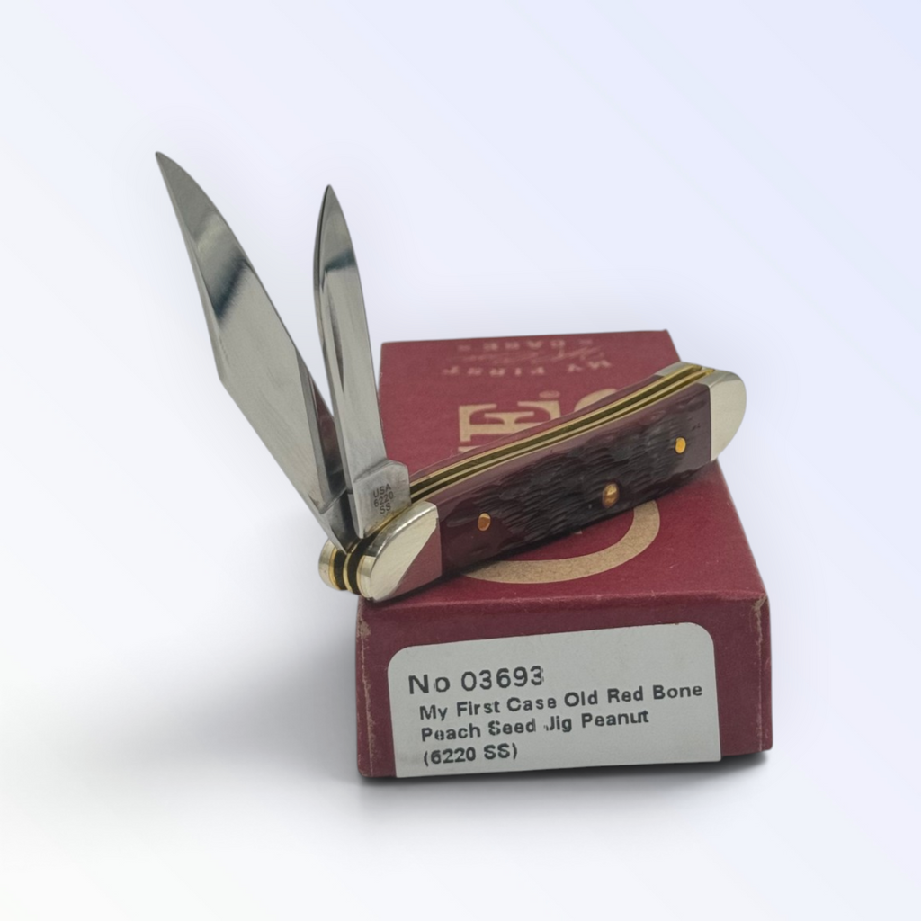 Case XX My First Case Old Red Bone Peach Seed Jig Peanut (03693) — pocket-knife studio shot on retail box