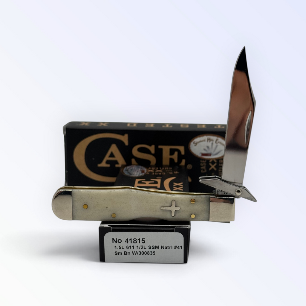 Case XX 41815 Cheetah Cub smooth natural bone with cross shield — locking clip and swing guard on Case box