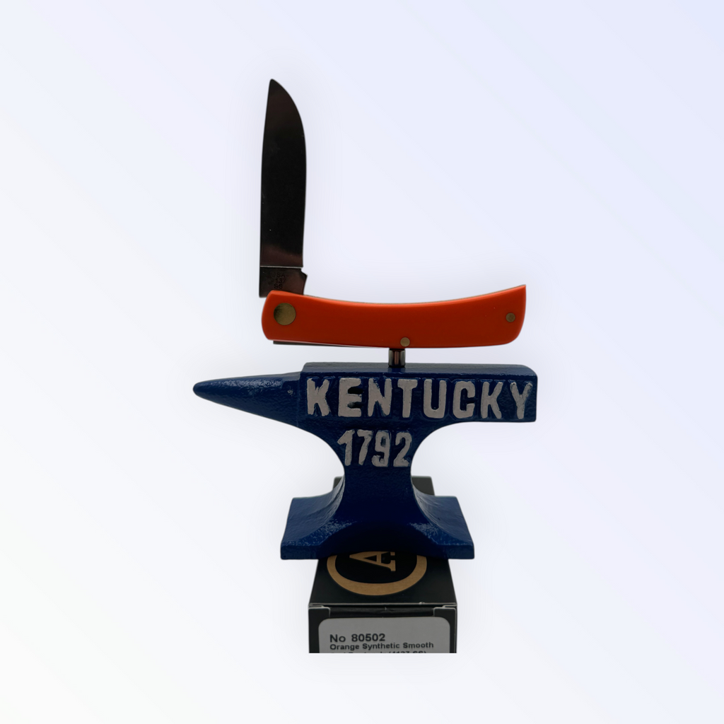 Pigeon Roost Knives Case XX Sod Buster Jr pocket knife with smooth orange handle and Aliens artwork on an anvil stand