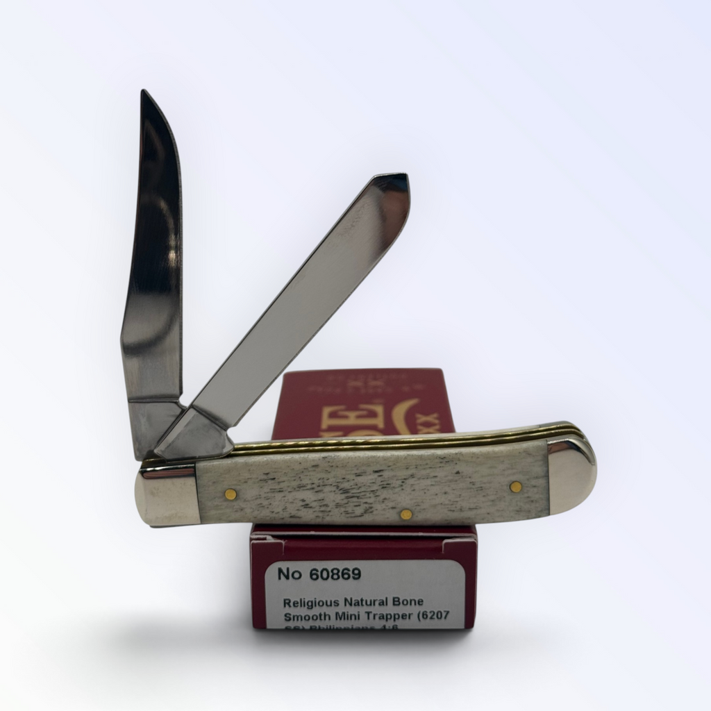 – Religious Natural Bone Smooth Mini Trapper (Philippians 4:6) by Case XX (60869), close view of handle texture with blades open on box
