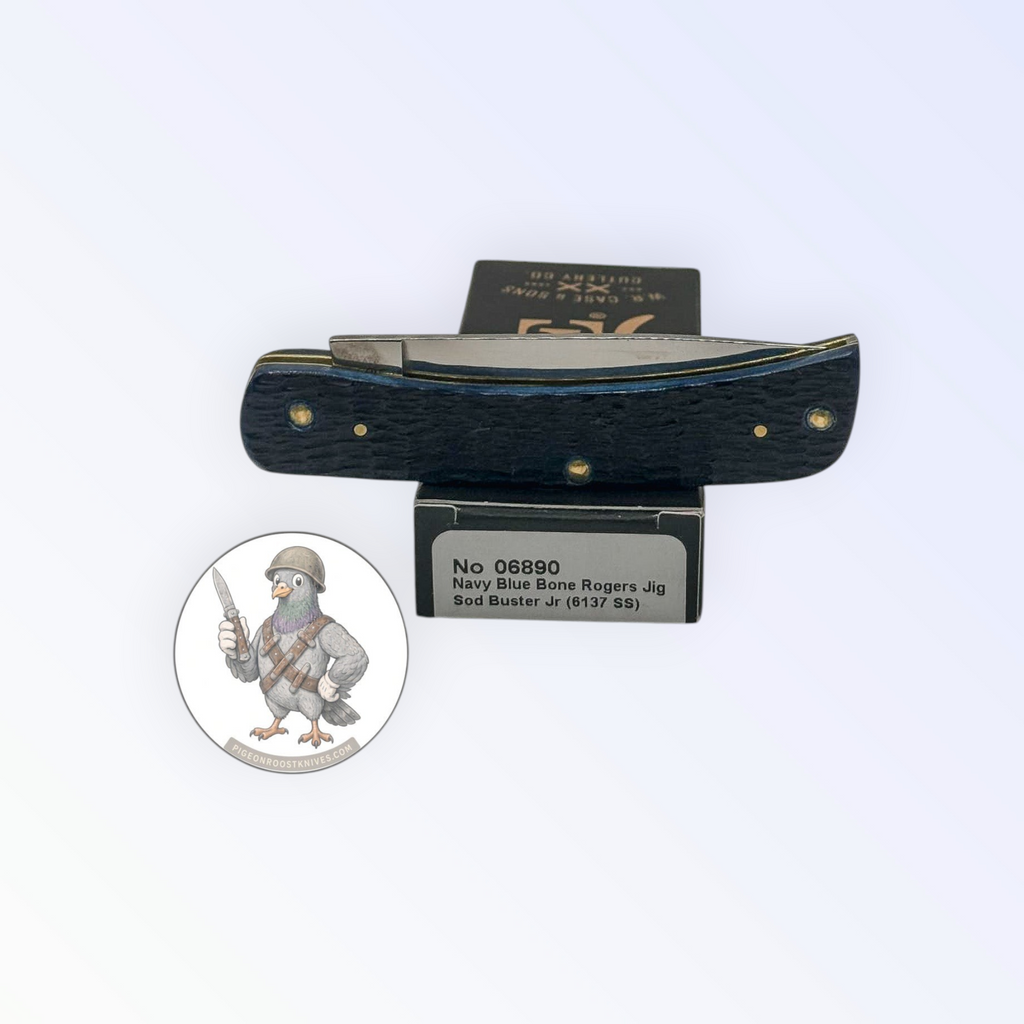 Catalog 06890 Case XX Rogers Jig Navy Blue Bone Sod Buster Jr — open blades resting on factory packaging