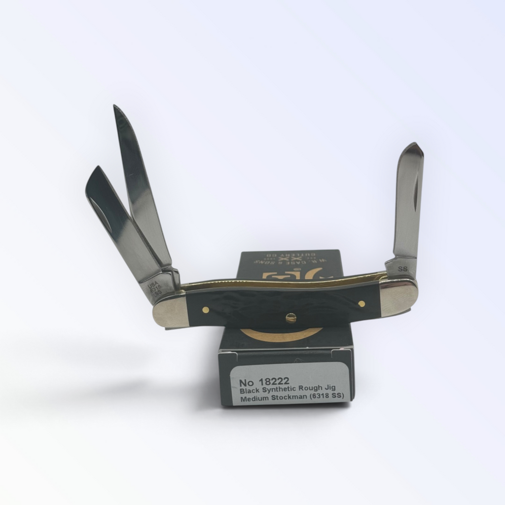 Rough Black Synthetic Medium Stockman by Case XX (18222), close view of handle texture with blades open on box