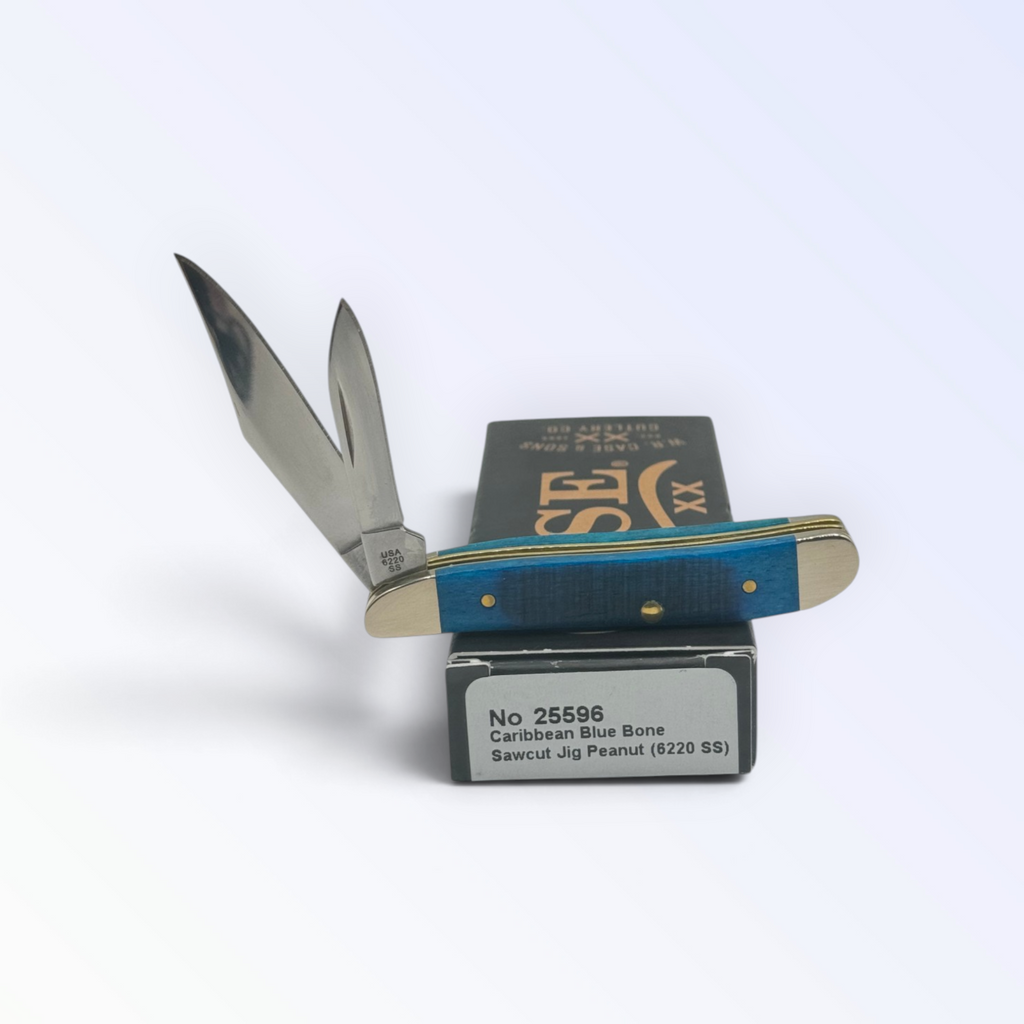 Sawcut Caribbean Blue Bone Peanut by Case XX (25596), close view of handle texture with blades open on box