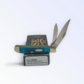 Case XX Sawcut Caribbean Blue Bone Peanut with SKU 25596 — blades open resting on the factory box