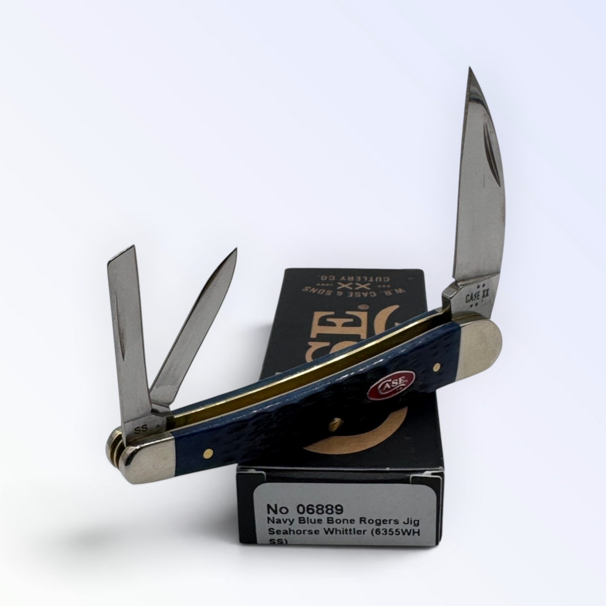 Pigeon Roost Knives Case XX Seahorse Whittler pocket knife with navy blue jigged bone handle and three steel blades.