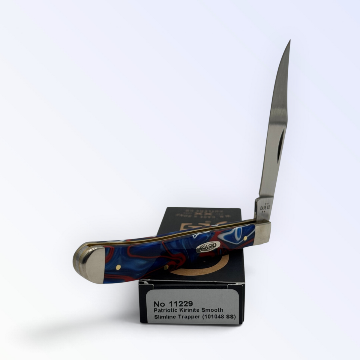 Slimline Trapper by Case XX in Patriotic Kirinite (11229), three-quarter open shot showing handle and blades