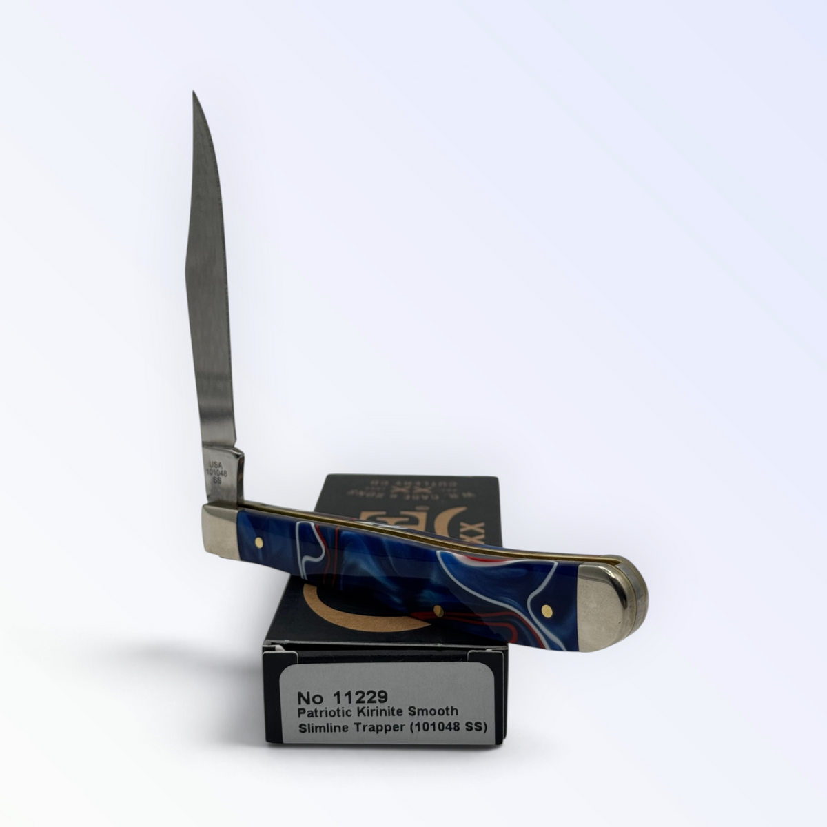 Case XX Slimline Trapper 11229: Patriotic Kirinite, open on box with end label facing forward
