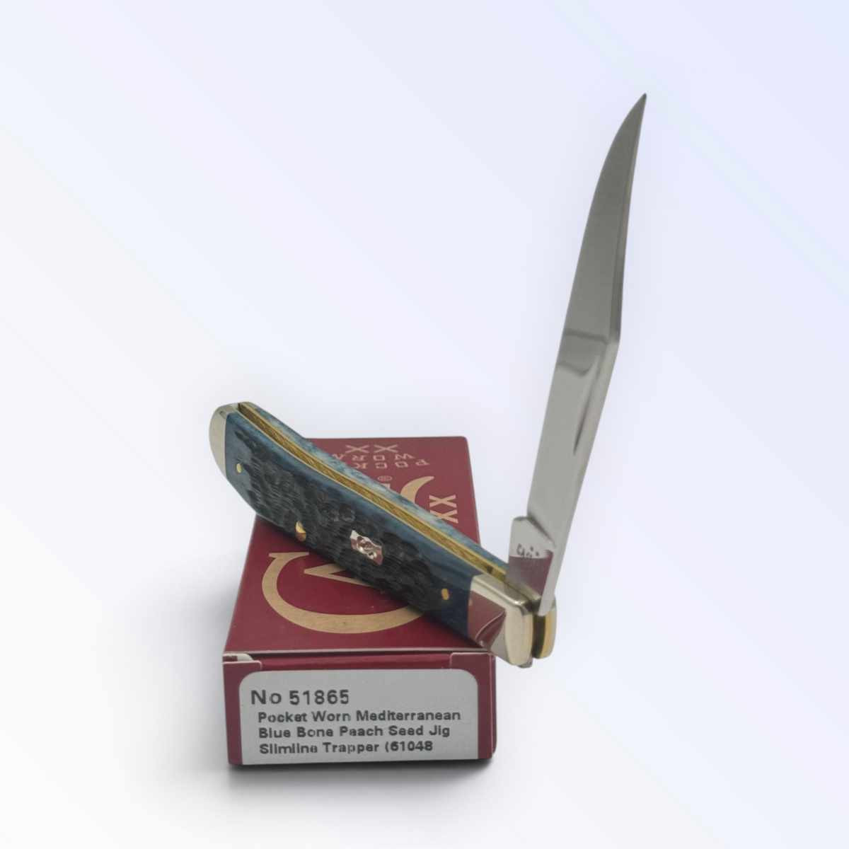 Case XX 51865 Slimline Trapper Peach Seed Mediterranean Blue Bone — angled open view on Case XX packaging