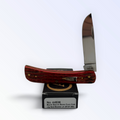 Case XX 44536 Sod Buster Jr smoked bacon bone — open skinner blade on Case XX retail box