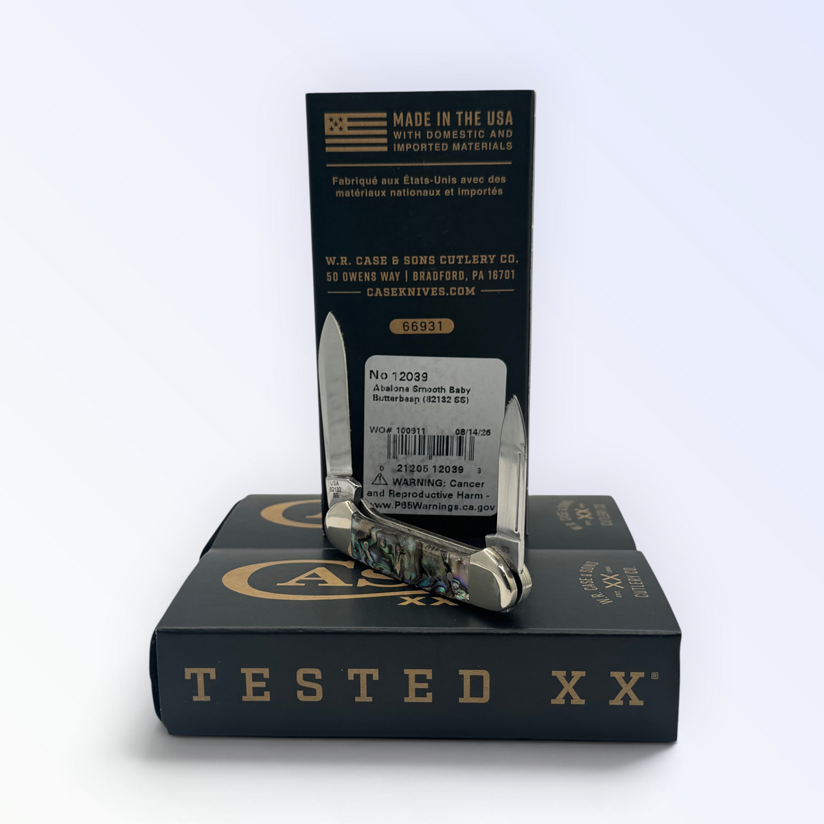 Catalog 12039 Case XX Smooth Abalone Butterbean — open blades resting on factory packaging