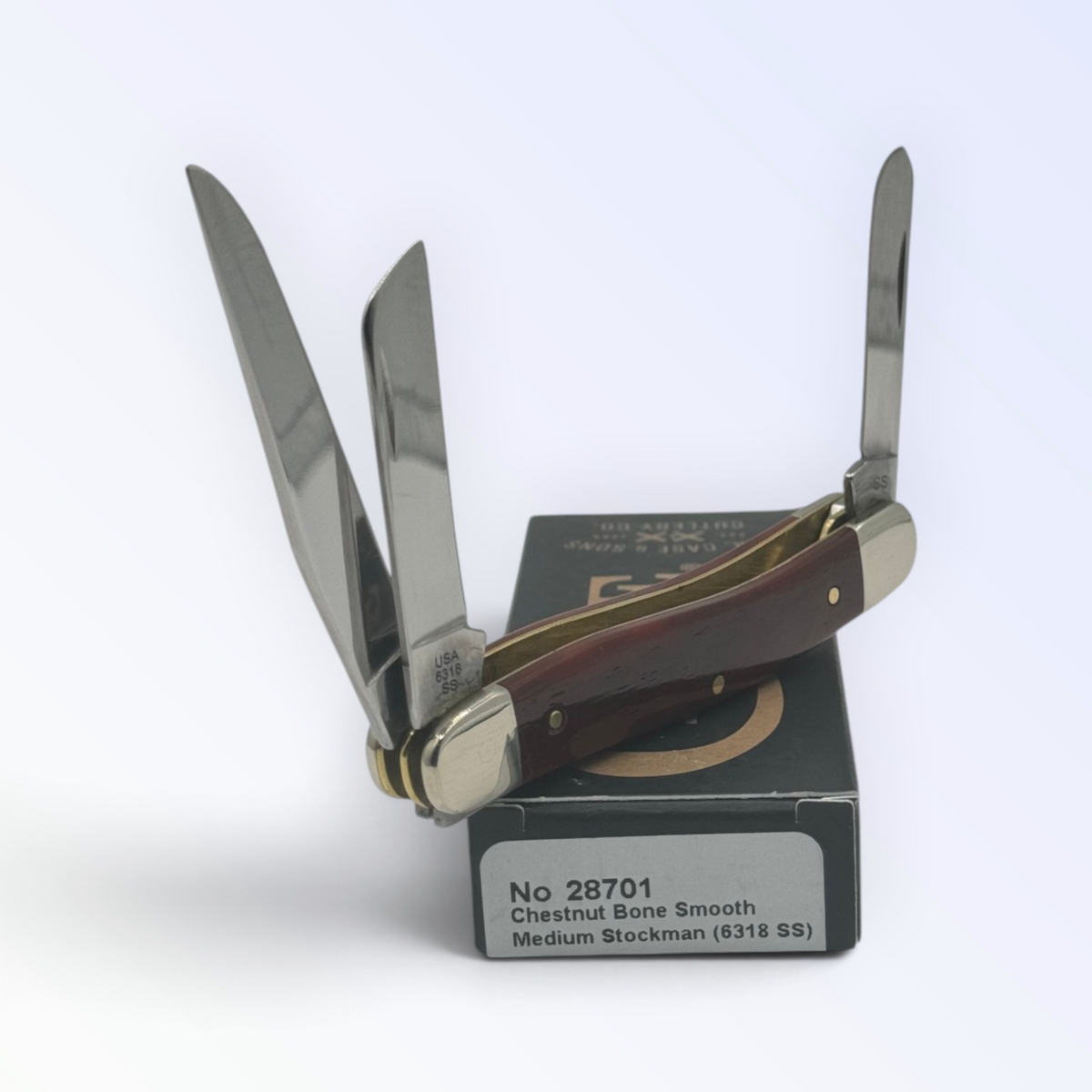 Case XX Smooth Chestnut Bone Medium Stockman (28701) — pocket-knife studio shot on retail box