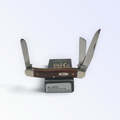 Case XX Smooth Chestnut Bone Medium Stockman with SKU 28701 — blades open resting on the factory box