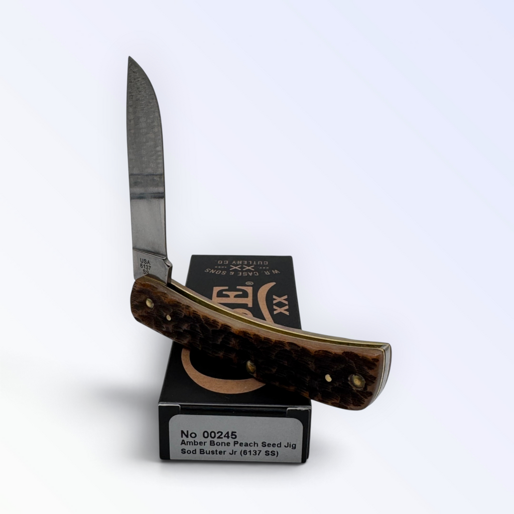 Pigeon Roost Knives Case XX Sod Buster Jr pocket knife with amber bone peach seed jig handle and stainless steel blade